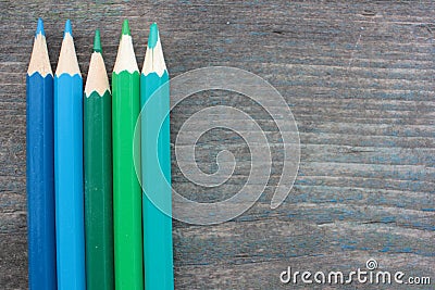 Ð¡ool colors Ñolored pencils on old wooden textured background. Top view. Copy space Stock Photo